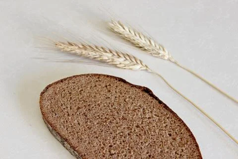 Bread and ear on a white background Stock Photos