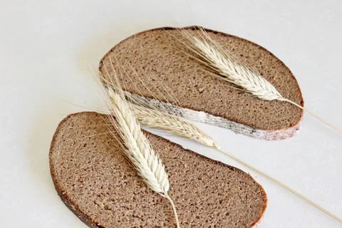 Bread and ear on a white background Stock Photos