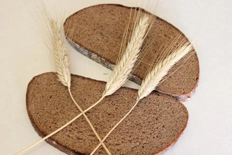 Bread and ear on a white background Stock Photos