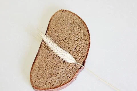 Bread and ear on a white background Stock Photos