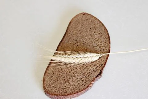 Bread and ear on a white background Stock Photos