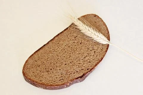 Bread and ear on a white background Stock Photos