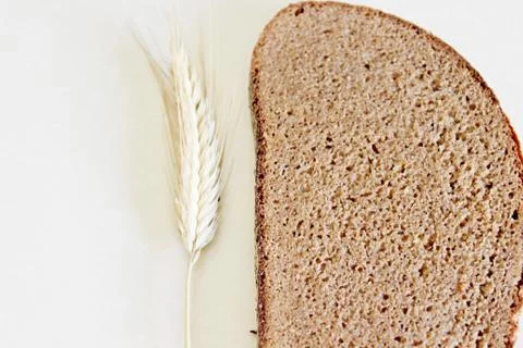 Bread and ear on a white background Stock Photos