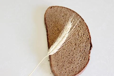 Bread and ear on a white background Stock Photos