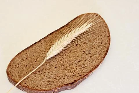 Bread and ear on a white background Stock Photos