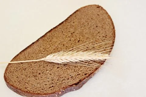 Bread and ear on a white background Stock Photos