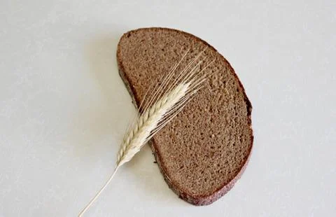 Bread and ear on a white background Stock Photos