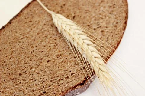 Bread and ear on a white background Stock Photos