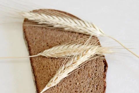 Bread and ear on a white background Stock Photos