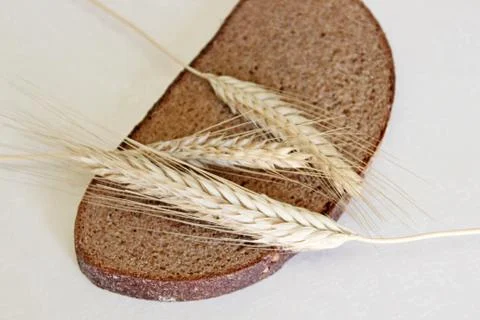 Bread and ear on a white background Stock Photos