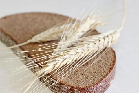 Bread and ear on a white background Stock Photos
