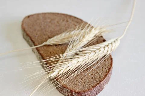 Bread and ear on a white background Stock Photos