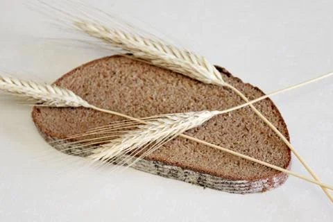 Bread and ear on a white background Stock Photos