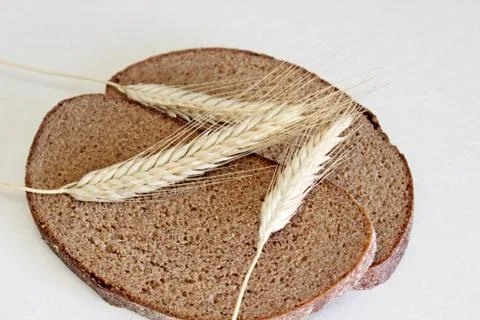 Bread and ear on a white background Stock Photos