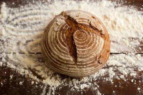 Bread and flour on the table Stock Photos