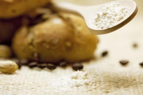 Bread and flour  on a wicker mat Stock Photos