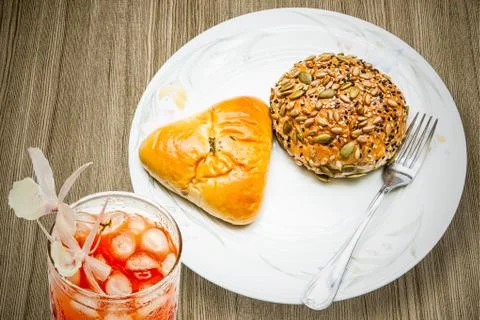 Bread and fork and drinks on the table Stock Photos