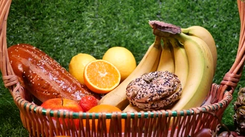Bread and fruit on the grass Stock Footage 346985392