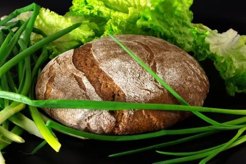 Bread and green vegetables salad and onions. Fresh and healthy food Stock Photos