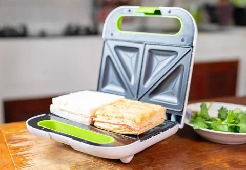 Bread and ham to make sanwich with grill sanwich maker. Stock Photos