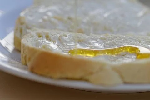Bread and honey Stock Photos