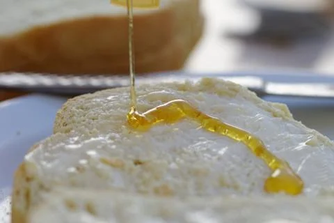 Bread and honey Stock Photos