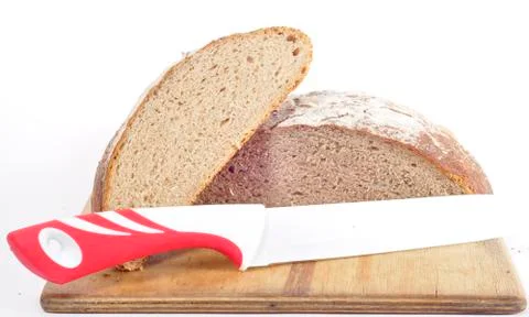 Bread and knife on white background Stock Photos