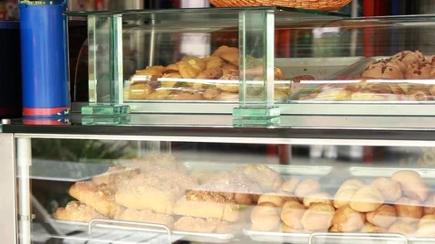 Bread and pastries in bakery display Stock Footage 90768474