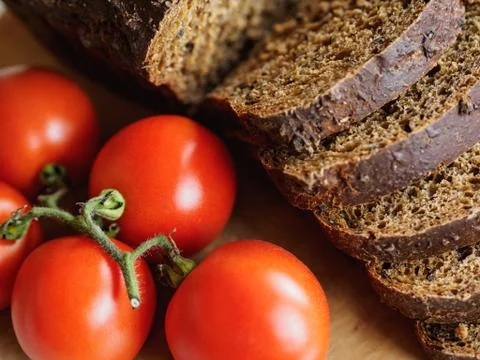 Bread and red tomatoes Stock-Fotos