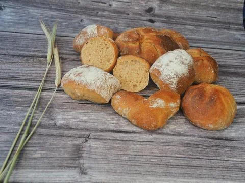 Bread and rolls fresh from the bakery, served warm. Stock Photos
