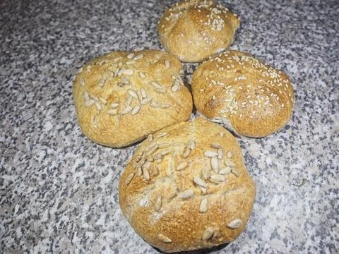 Bread and rolls fresh from the bakery, served warm. Stock Photos