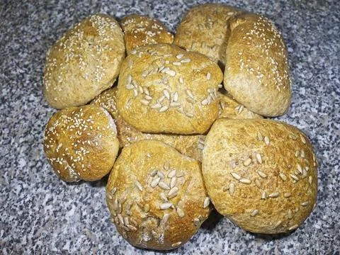 Bread and rolls fresh from the bakery, served warm. Stock Photos