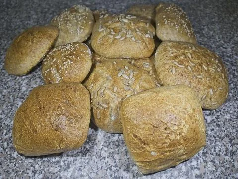 Bread and rolls fresh from the bakery, served warm. Stock Photos