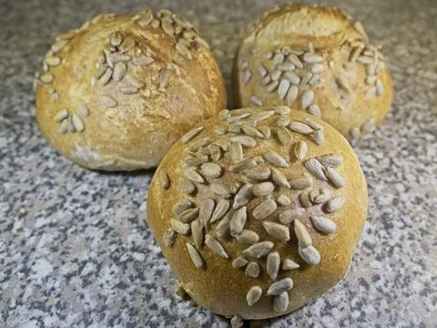 Bread and rolls fresh from the bakery, served warm. Stock Photos