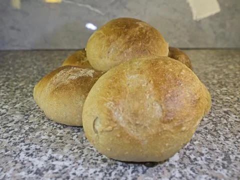 Bread and rolls fresh from the bakery, served warm. Stock Photos