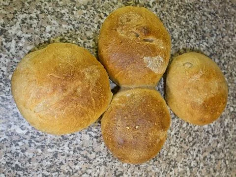 Bread and rolls fresh from the bakery, served warm. Stock Photos