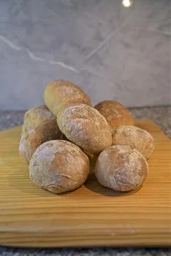 Bread and rolls fresh from the bakery, served warm. Stock Photos