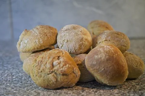 Bread and rolls fresh from the bakery, served warm. Stock Photos