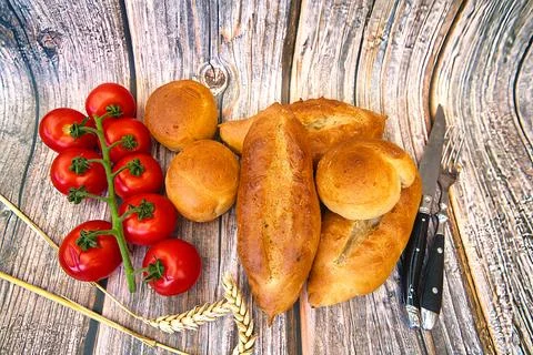 Bread and rolls fresh from the bakery, served warm. Stock Photos