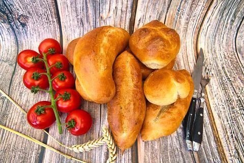 Bread and rolls fresh from the bakery, served warm. Stock Photos