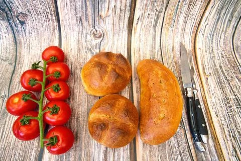 Bread and rolls fresh from the bakery, served warm. Stock Photos