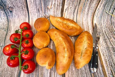 Bread and rolls fresh from the bakery, served warm. Stock Photos