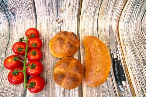 Bread and rolls fresh from the bakery, served warm. Stock Photos