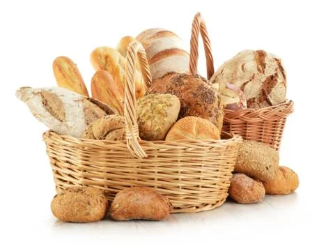 Bread and rolls in wicker basket isolated on white Stock Photos