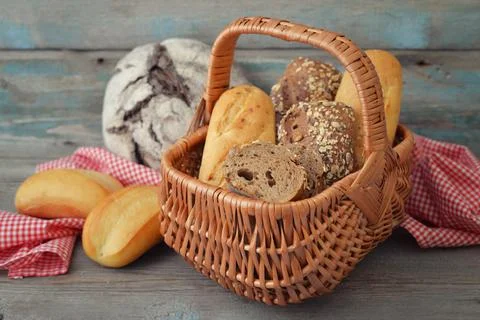 Bread and rolls in wicker basket Stock Photos