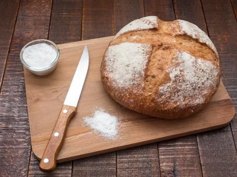 Bread and salt. Prepared according to the classic recipe in the oven. Stock Photos