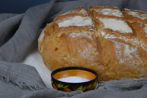 Bread and salt on the rustic background Stock Photos