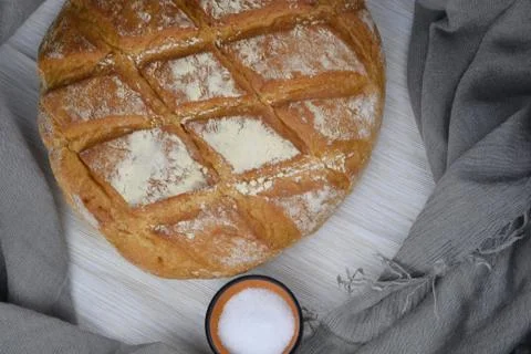 Bread and salt on the rustic background Stock Photos