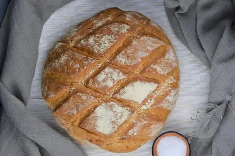 Bread and salt on the rustic background Stock Photos