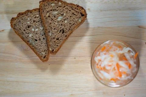Bread and salted cabbage top view. selective focus Stock Photos